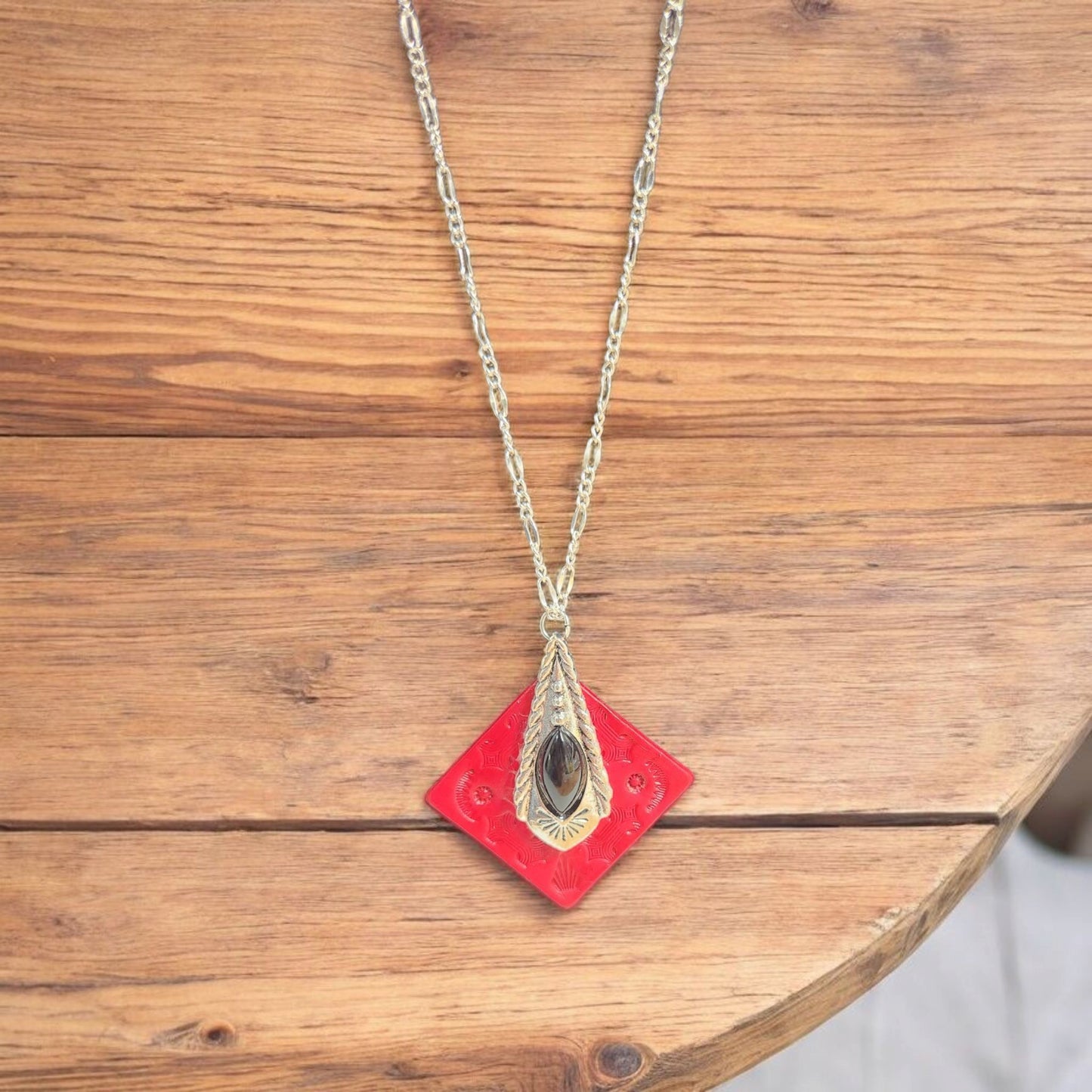 Beautiful tooled red leather pendant with a Classy Black and Silver Accent
