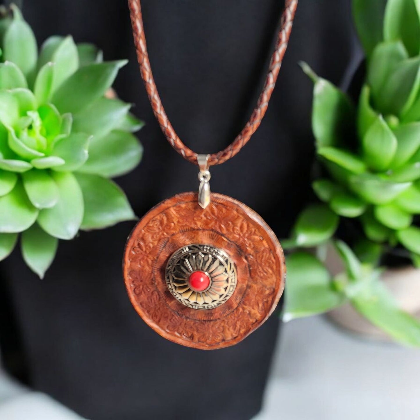 Beautifully tooled 2 1/2" leather pendant