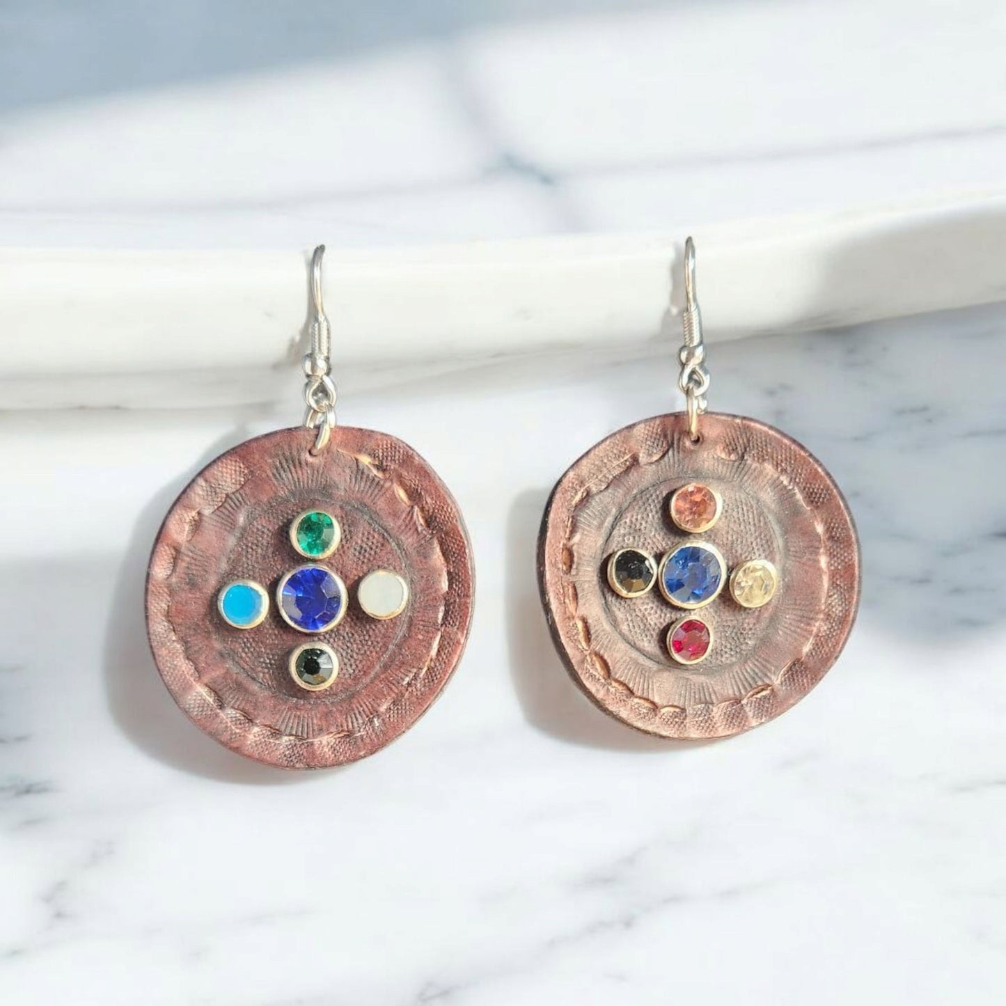 Beautiful tooled round earring with inset jewels