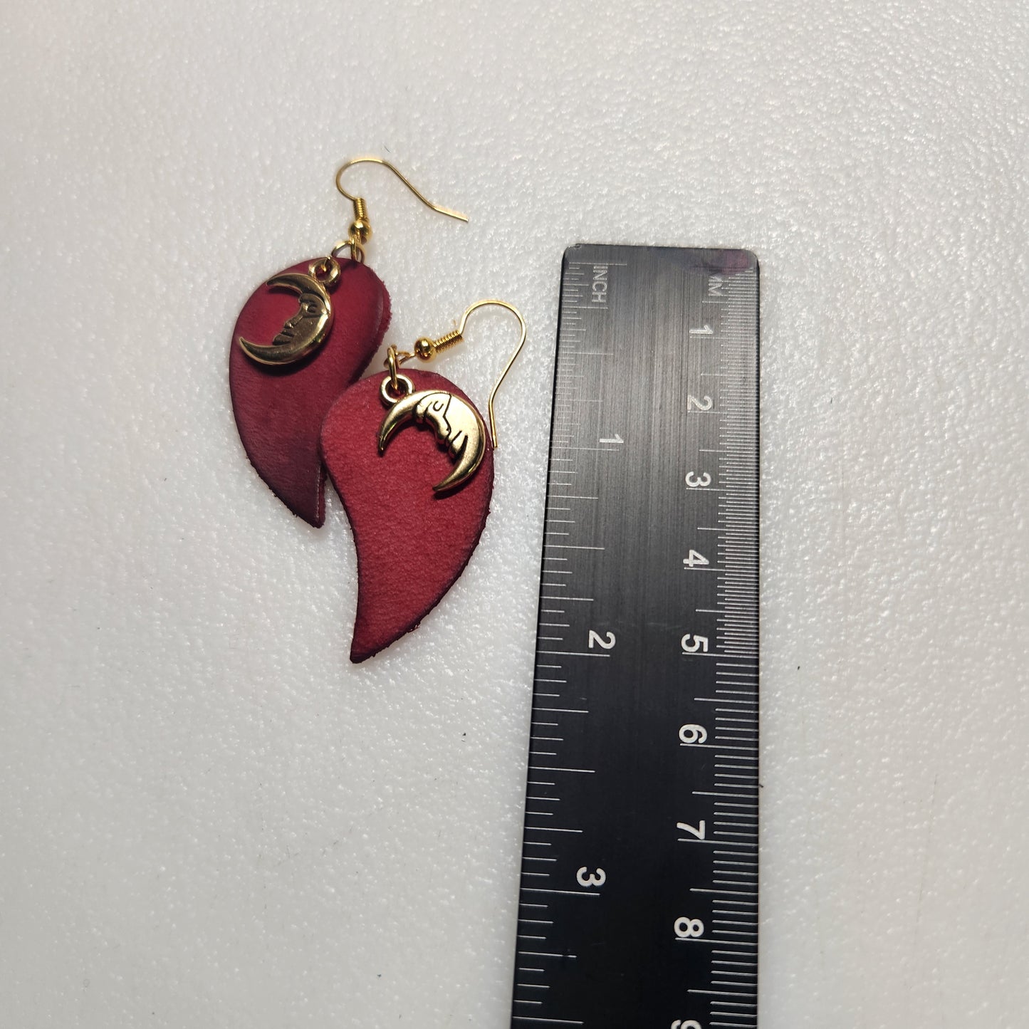 Deep Red Leather Earring with Enchanting Gold-toned Charm