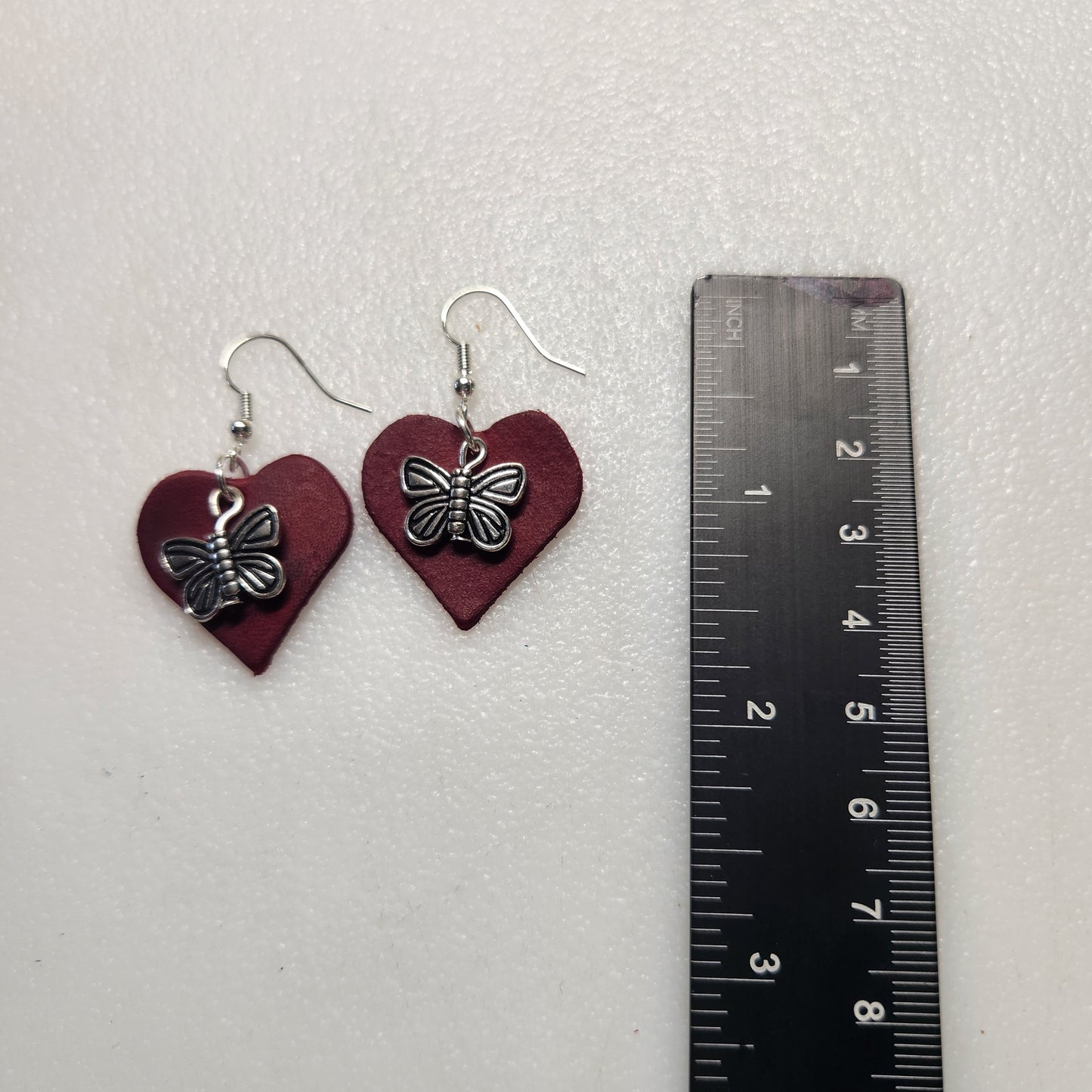 Classy Red Leather Earrings with Silver-toned Butterfly Charm