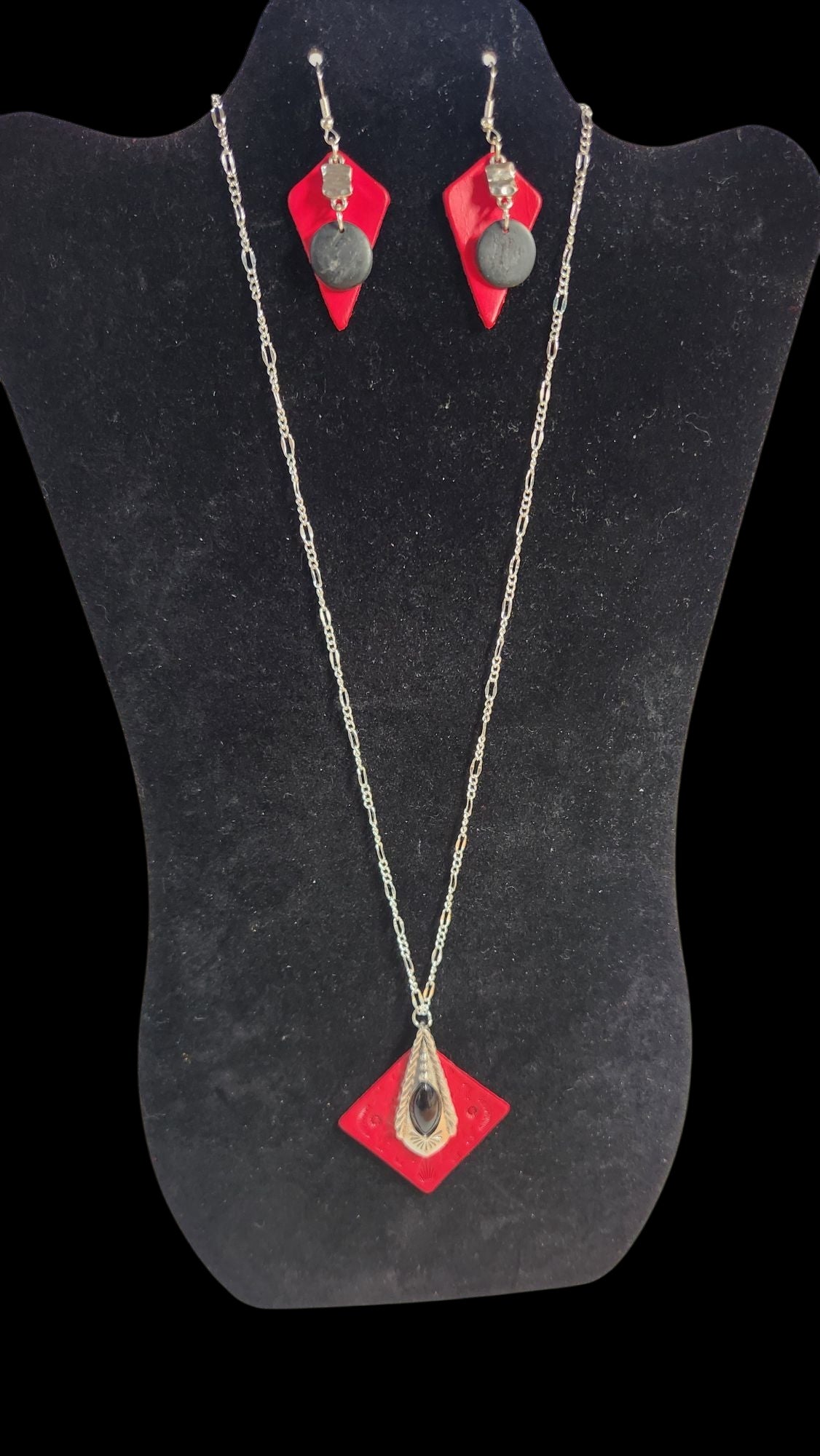 Beautiful tooled red leather pendant with a Classy Black and Silver Accent