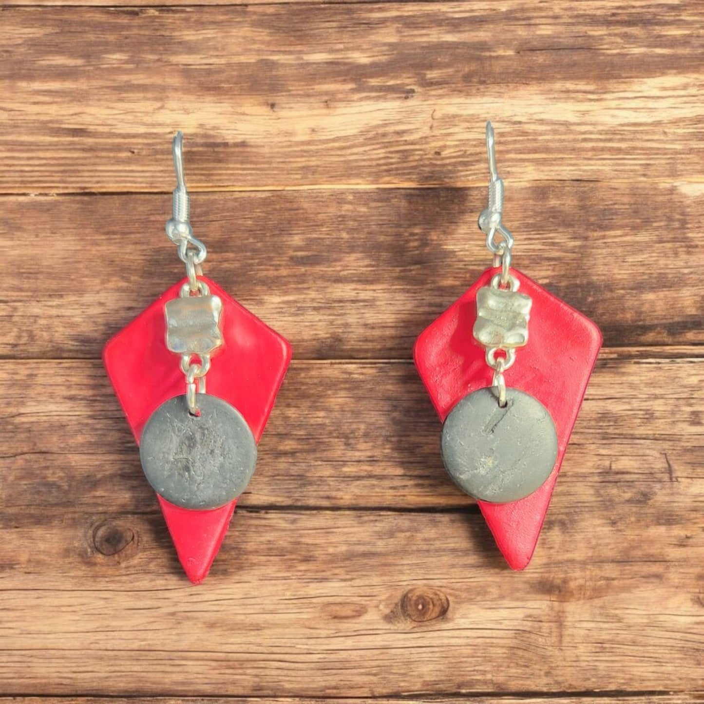 Beautiful tooled red leather pendant with a Classy Black and Silver Accent