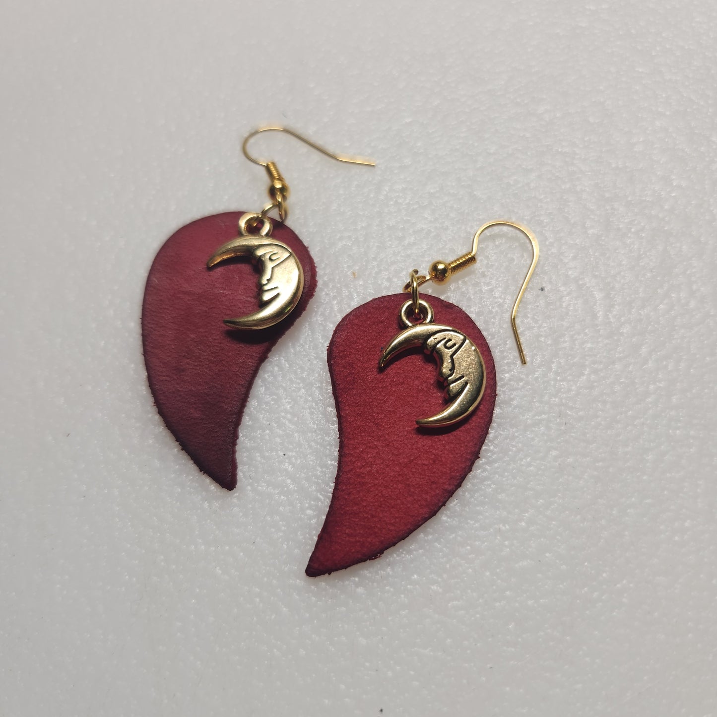 Deep Red Leather Earring with Enchanting Gold-toned Charm